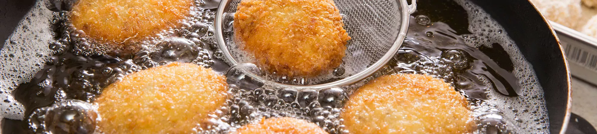 best-deep-frying-utensils-header Best Deep Frying Utensils used in a pot of hot oil and croiquets